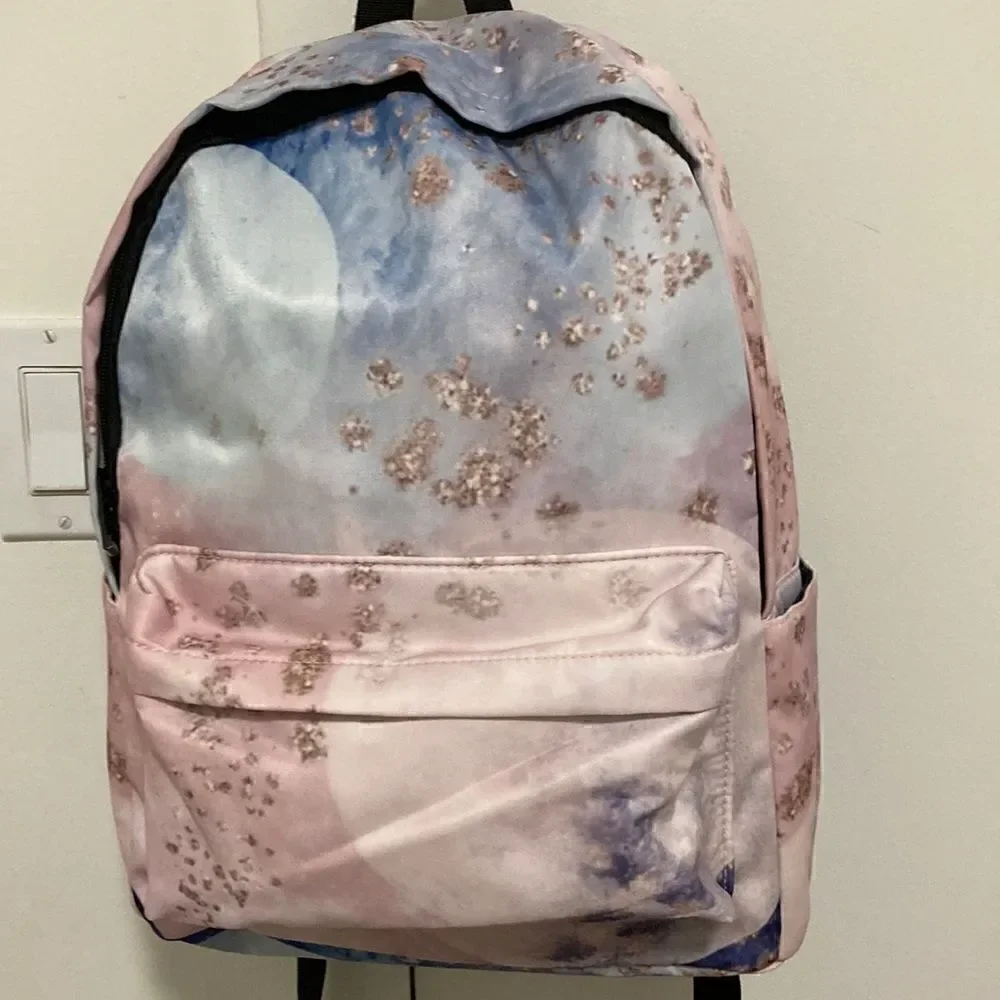 Yin Lang Nylon Backpack by Soundbyte in Pink & blue pattern.